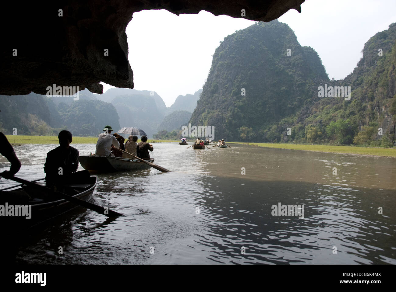 Tam Coc (Three Caves) on the Ngo Dong River, north Vietnam A boat ride on the Ngo Dong River Tam Coc, Vietnam Stock Photo
