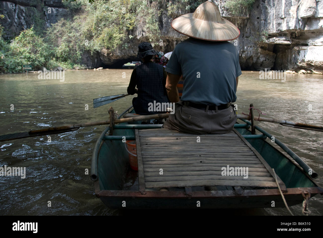 A boat ride on the Ngo Dong River, Tam Coc (Three Caves), Vietnam Stock Photo