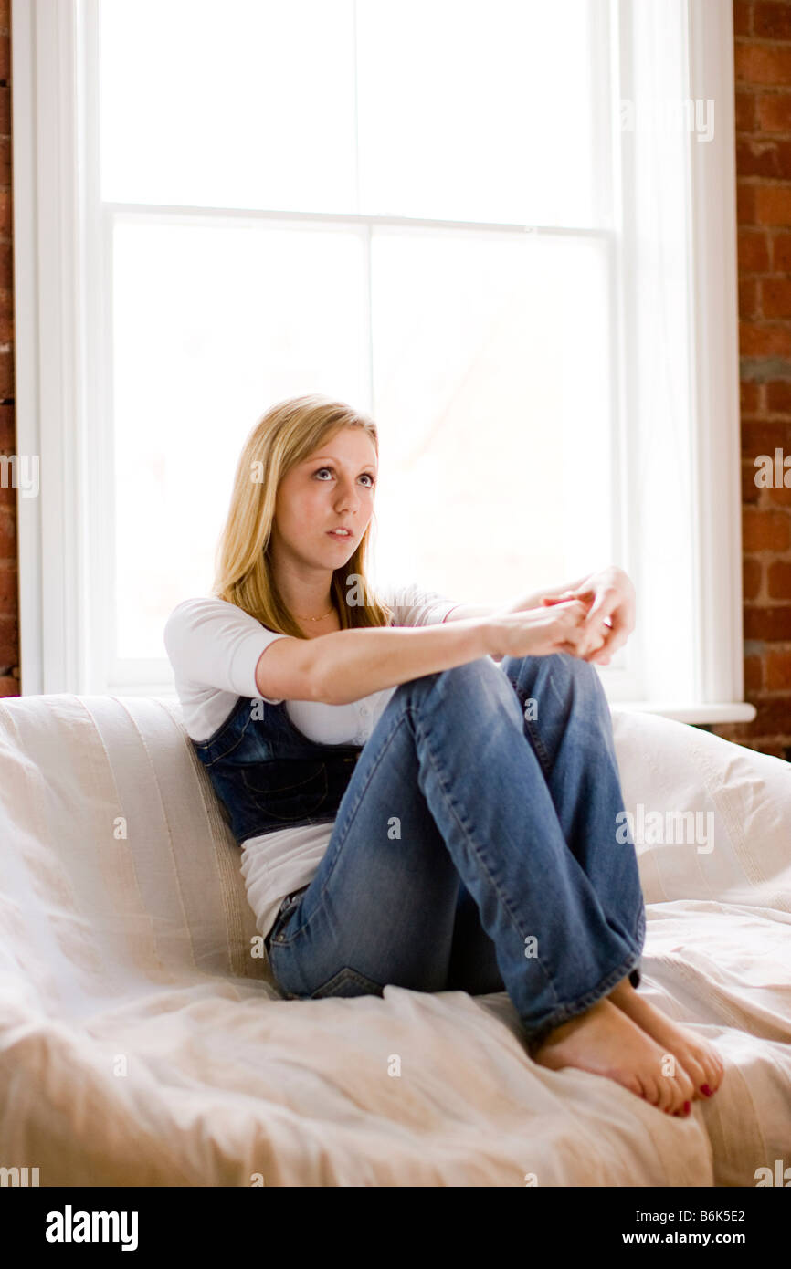 Portrait of teen sat on Sofa Stock Photo - Alamy