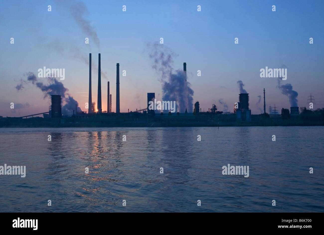 steel industry sunset river steam river Rhine Stock Photo