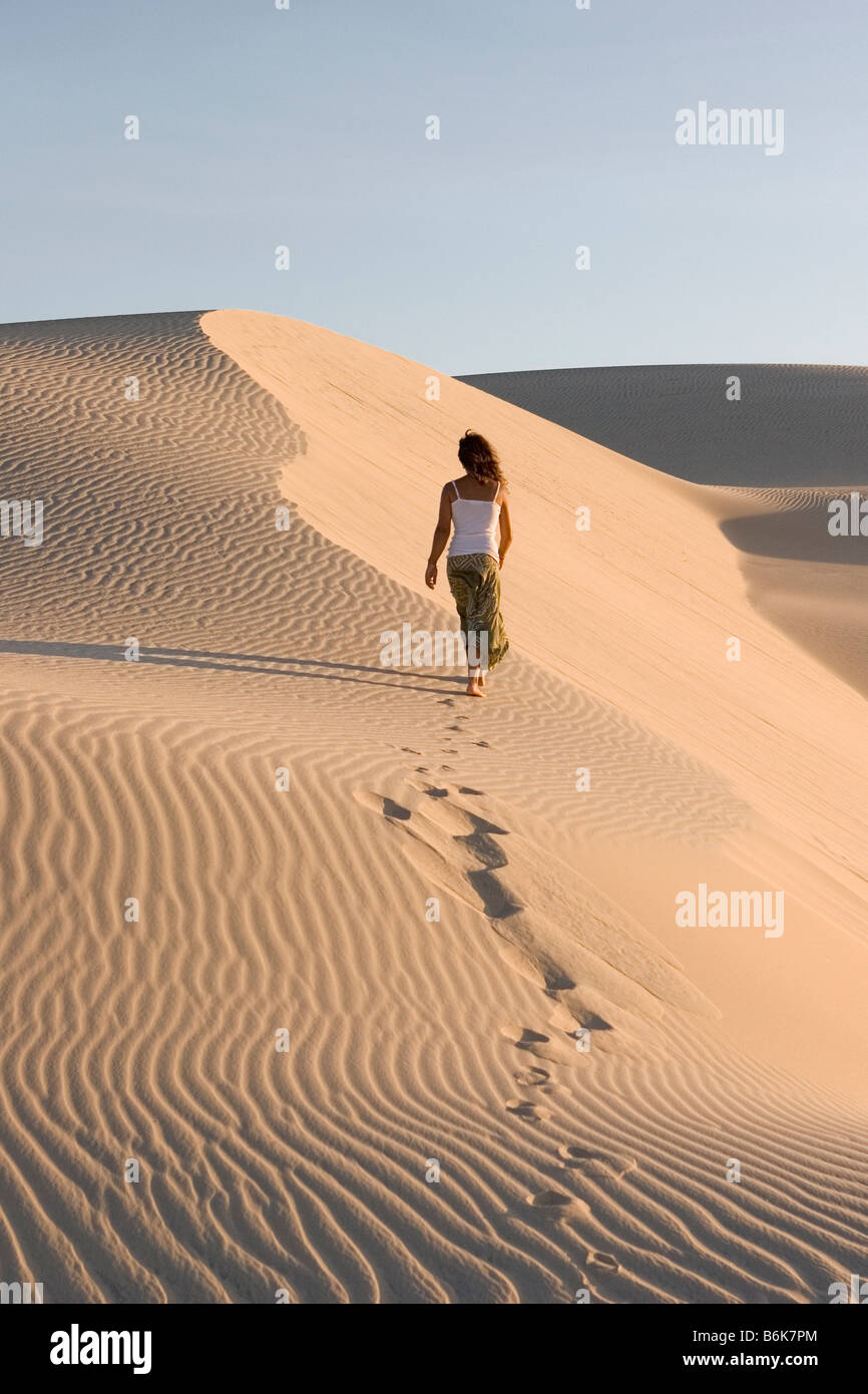woman climbing sand dune, Cumbuco, brasil Stock Photo Alamy