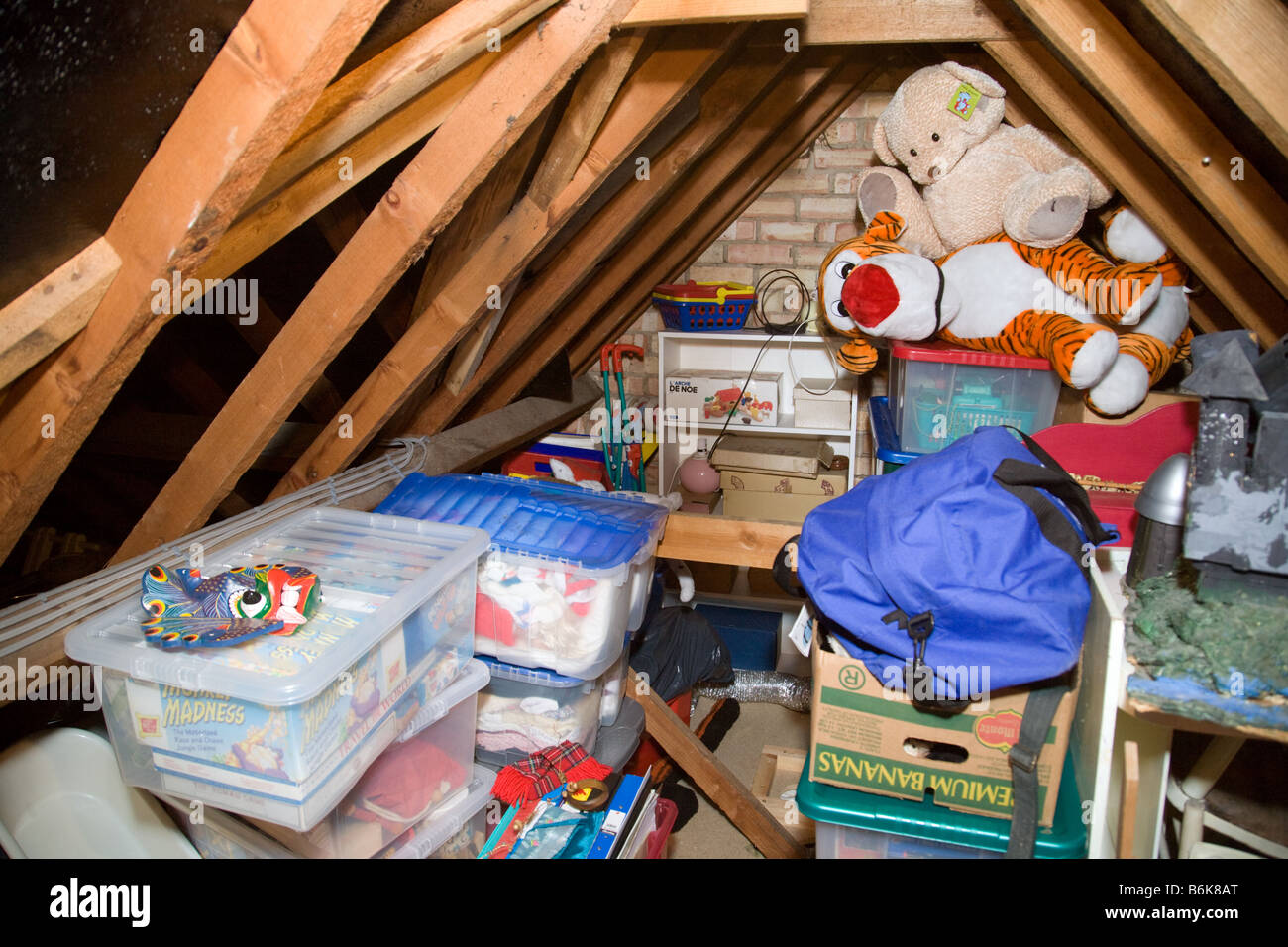 An attic or loft full of old junk and toys, UK Stock Photo