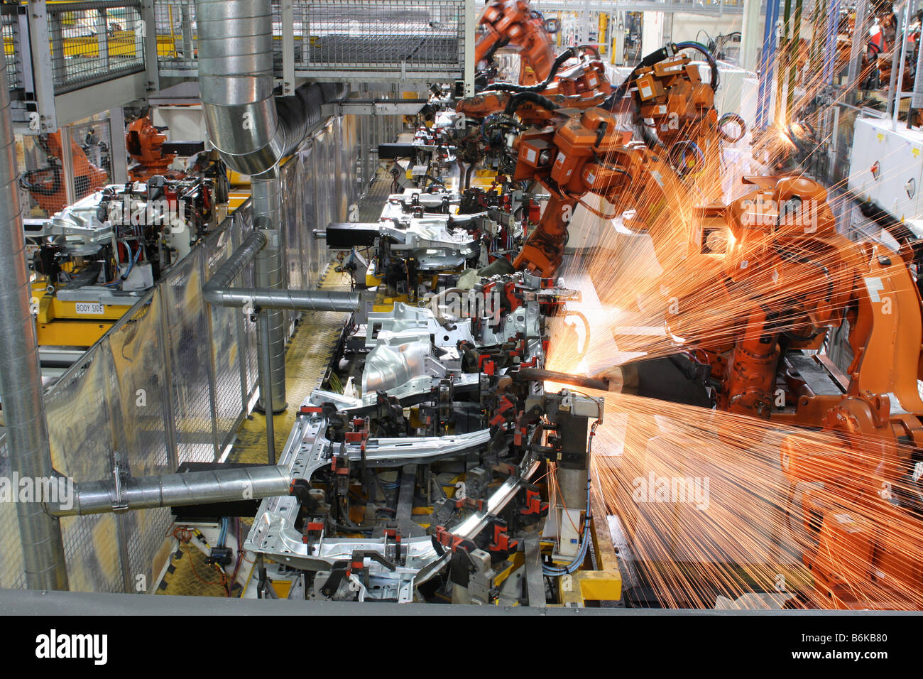 Robots welding a Freelander side at Jaguar Land Rover's Halewood factory Stock Photo