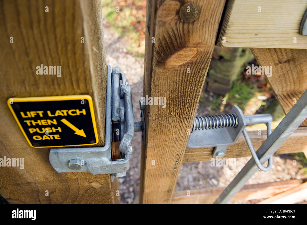 Latch on a wooden two way opening gate Stock Photo
