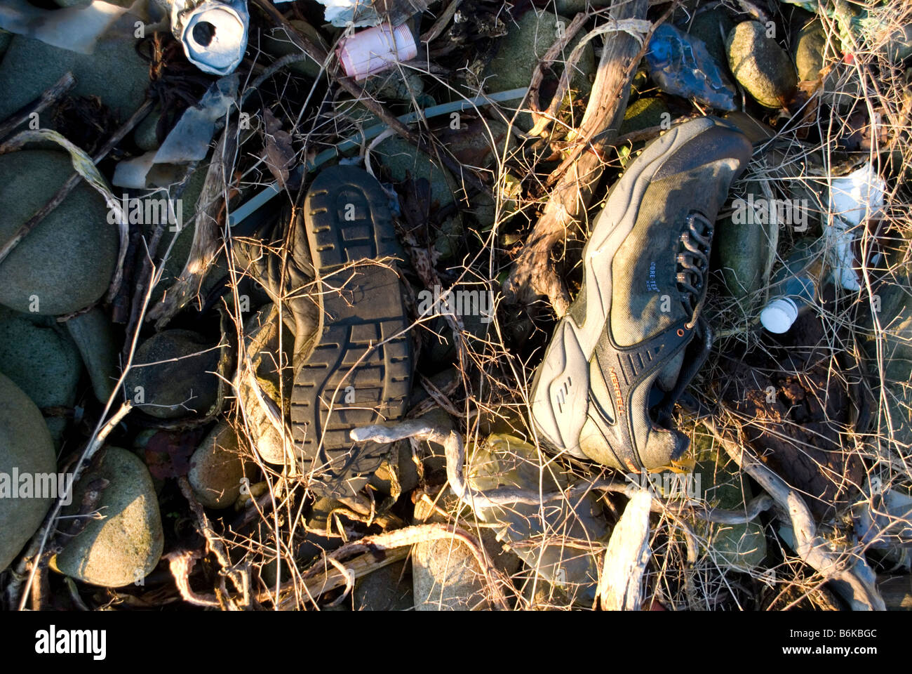 Discarded training shoes on beach in Donegal, Ireland. Stock Photo