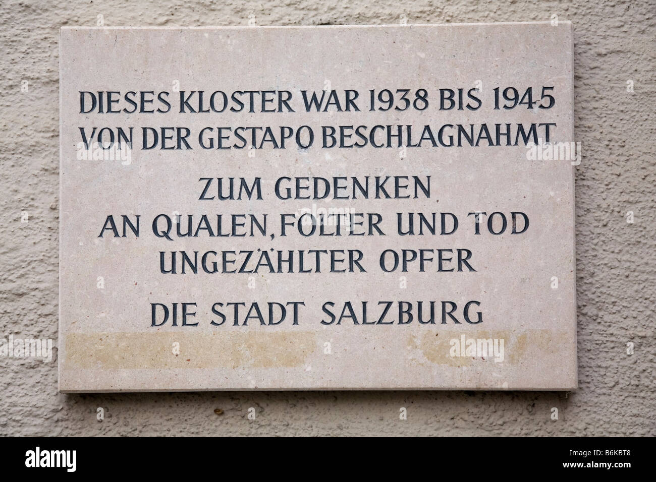 A sign in the historic city of Salzburg acts as a memorial to the victims of the Gestapo, the Nazi secret police. Stock Photo