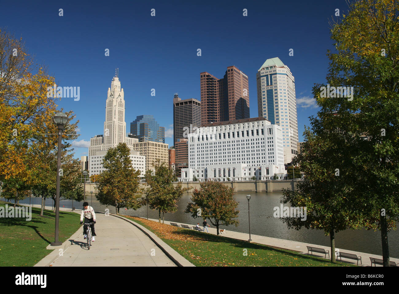 Columbus Downtown Looking North East over the Scioto River Columbus Ohio Man on bicycle has CUBA on shirt Stock Photo