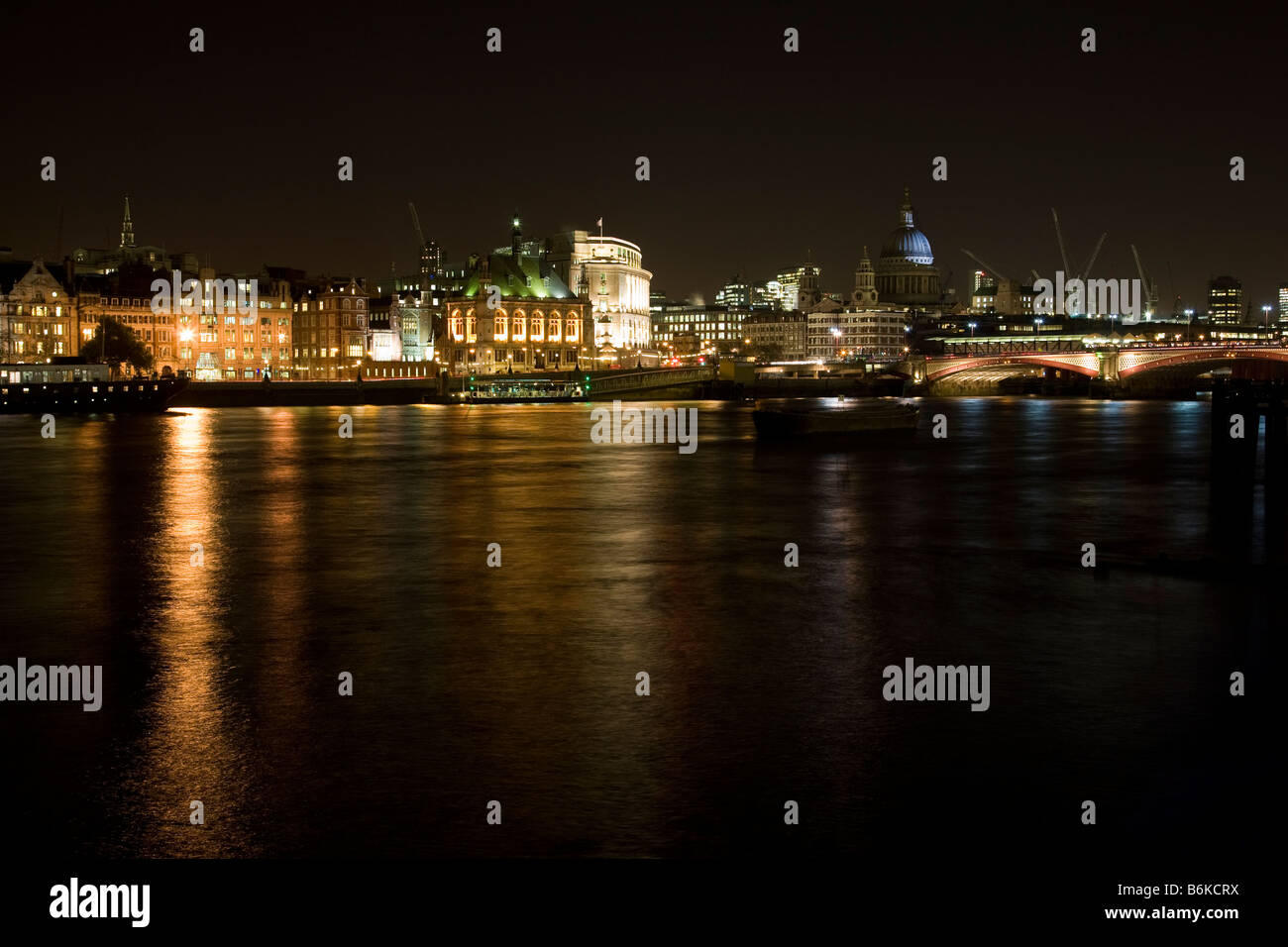 View of the London skyline including Charing Cross and St Paul's cathedral, as viewed from the Jubilee Gardens at night, London Stock Photo