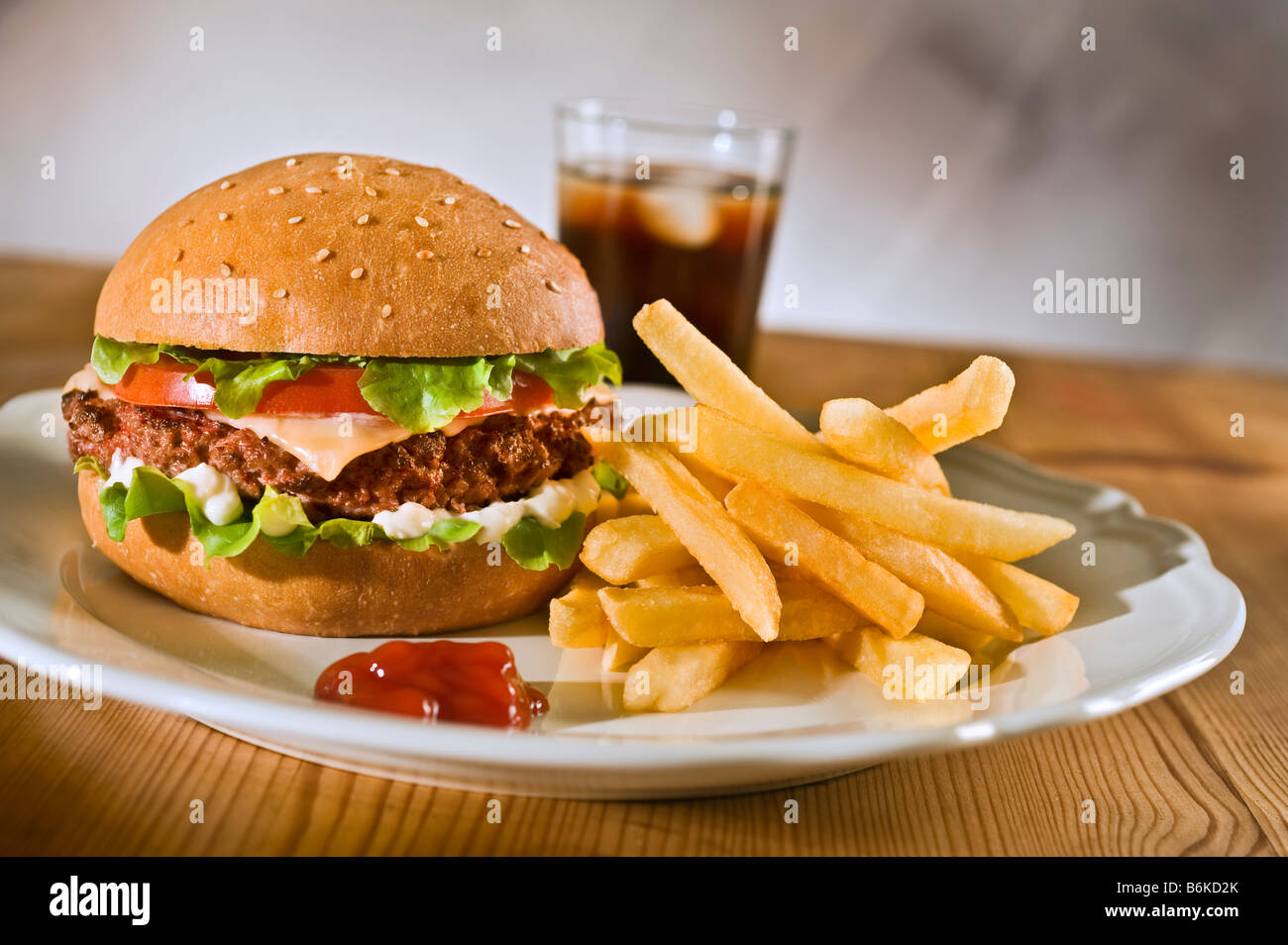 cheeseburger french rries and coke on a plate Stock Photo Alamy