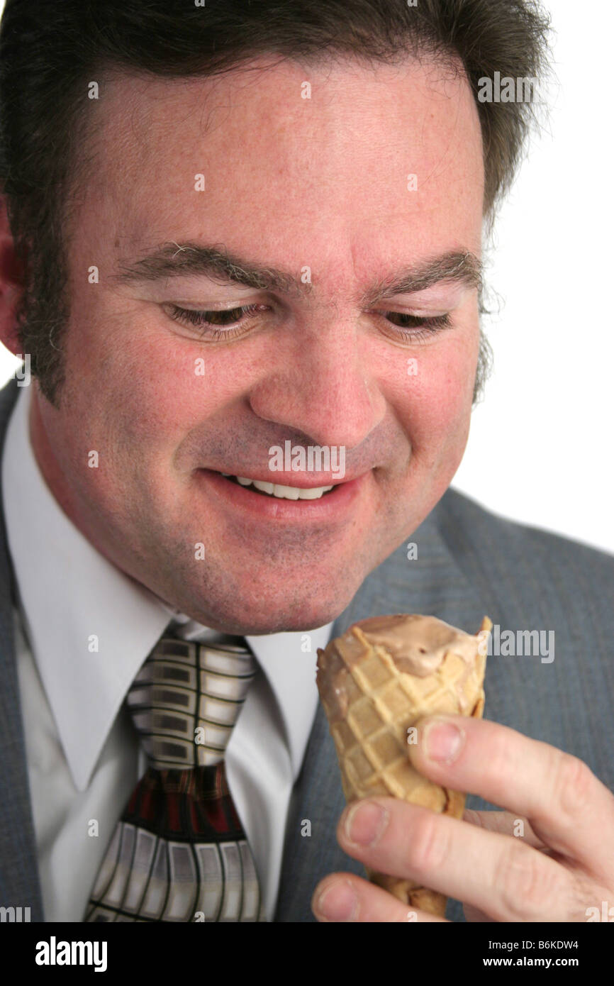 A closeup of a businessman looking at an ice cream cone with love Stock Photo