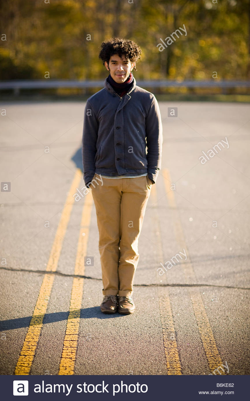 Young Handsome Black Man With Curly Hair Outside At Sunset Wearing