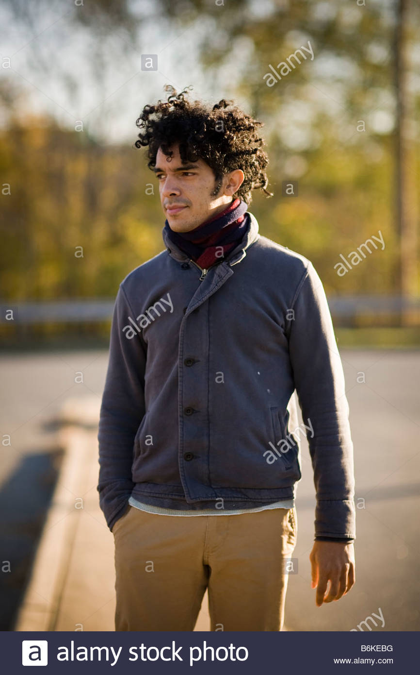 Young Handsome Black Man With Curly Hair Outside At Sunset