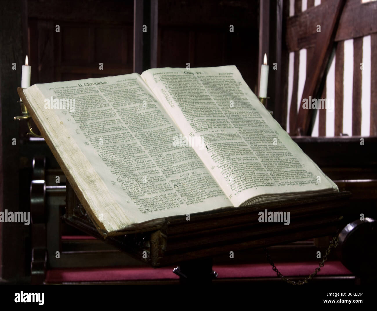 Ancient church bible on a reading stand in an old black and white tudor