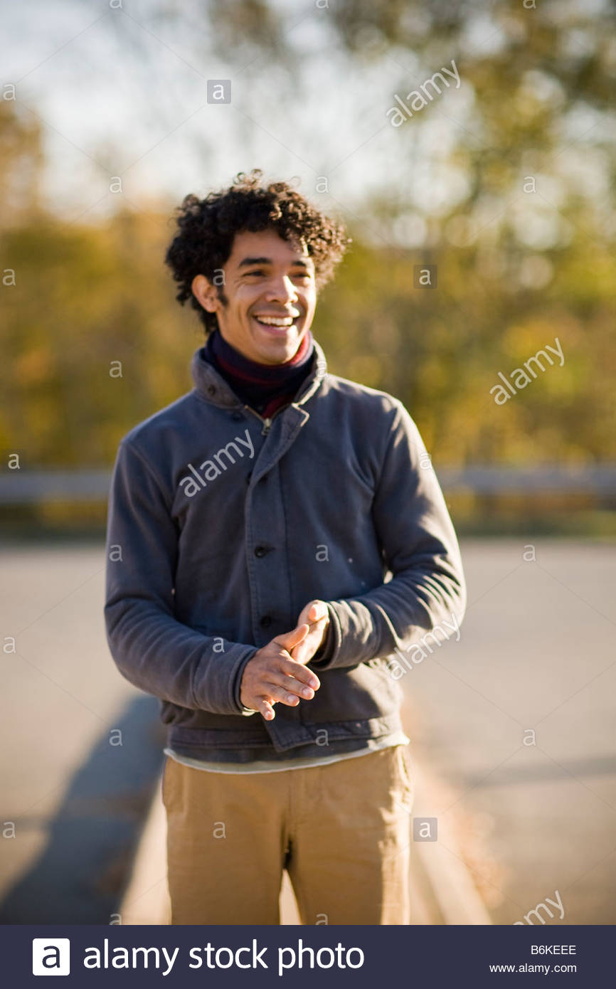Young Handsome Black Man With Curly Hair Outside At Sunset