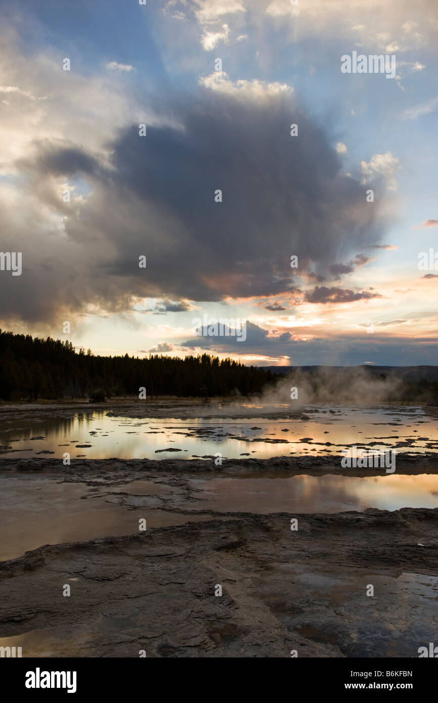 Dramatic sky at sunset, Great Fountain Geyser, Midway Geyser Basin, Yellowstone National Park, Wyoming, USA Stock Photo