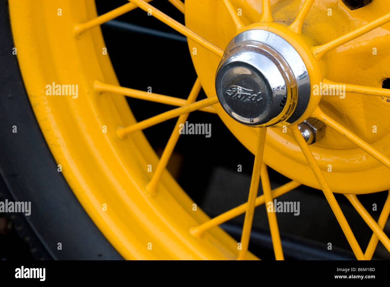 Antique automobile wheel with yellow spokes Stock Photo Alamy