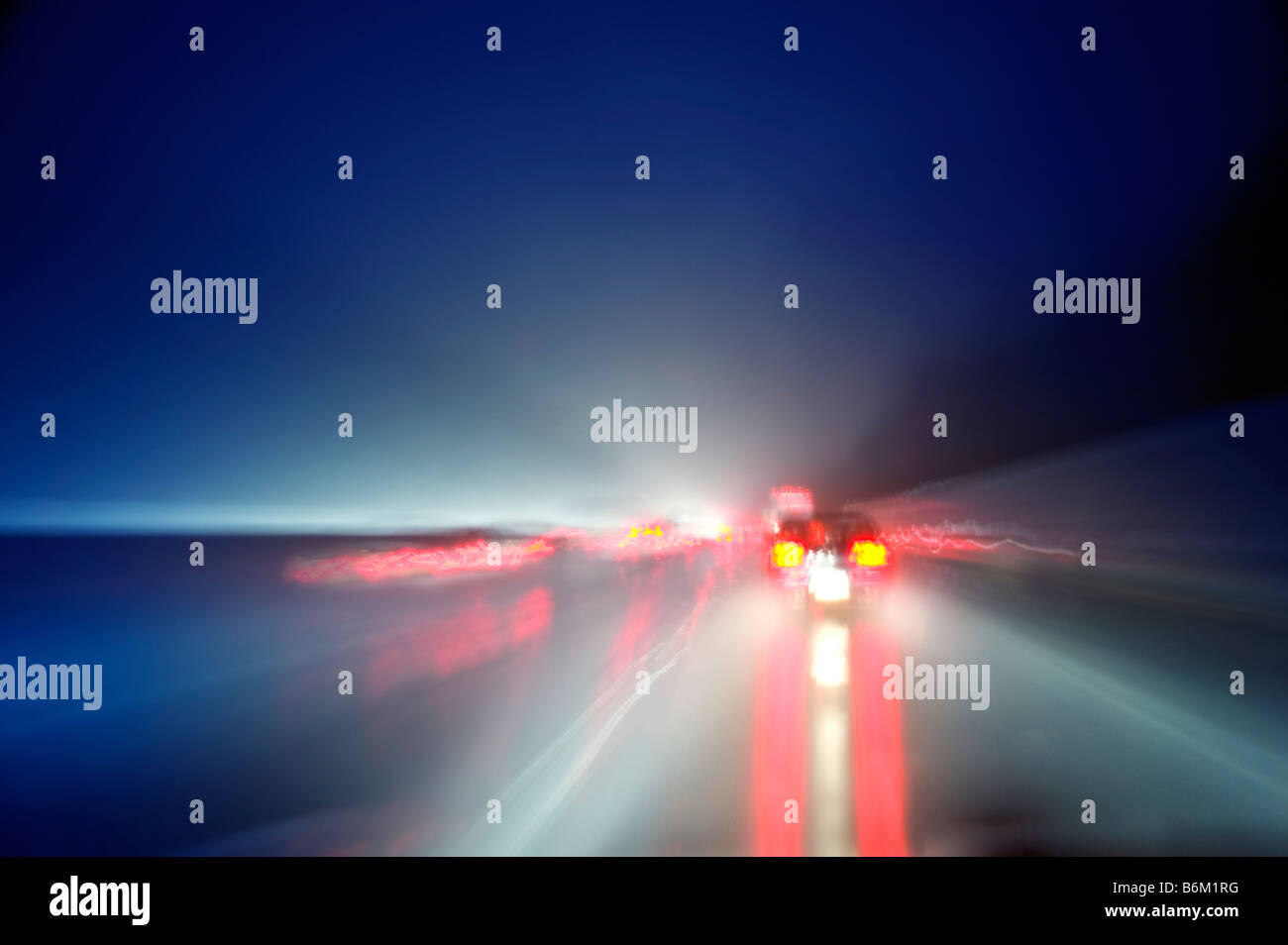 Cars On Highway At Night During Rain Storm, USA Stock Photo