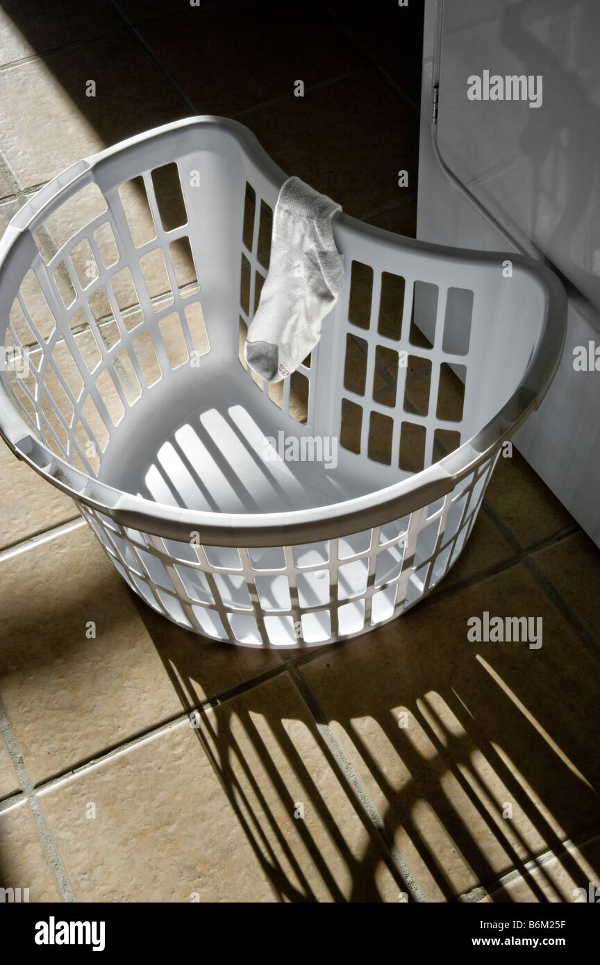 Laundry Basket With Sock & Shadows In Laundry Room Stock Photo Alamy