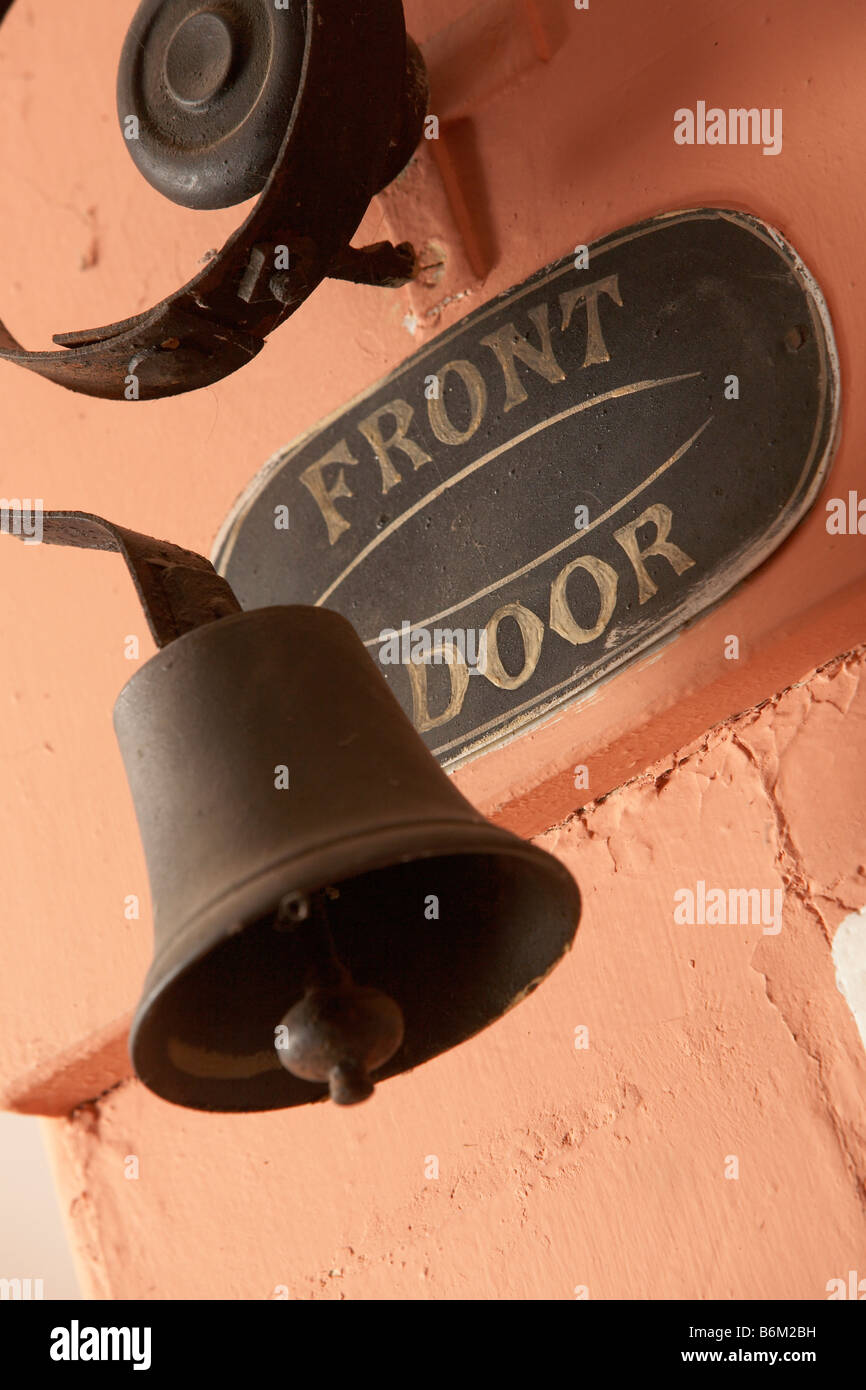 Front door bell and enamel sign. Stock Photo