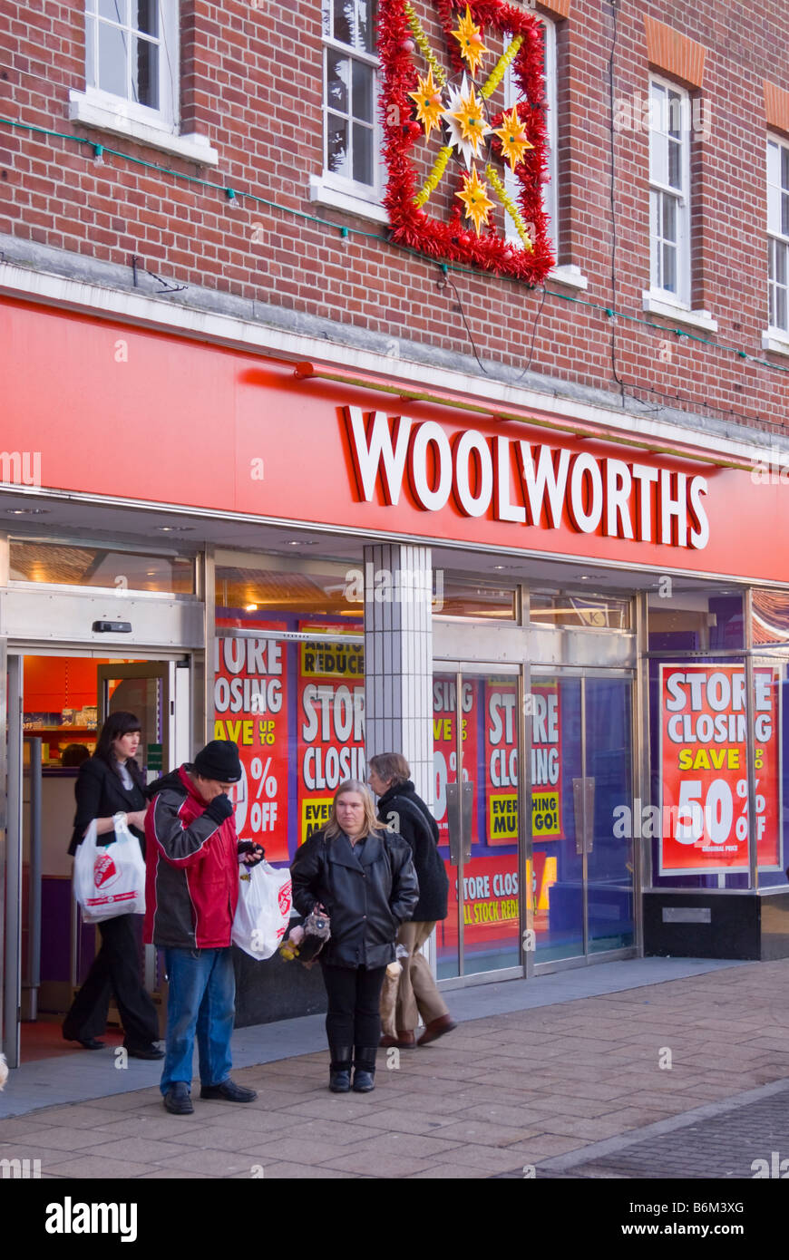 Woolworths shop store in Beccles,Suffolk,Uk with customers and people outside in December 2008 just before it finally closes Stock Photo