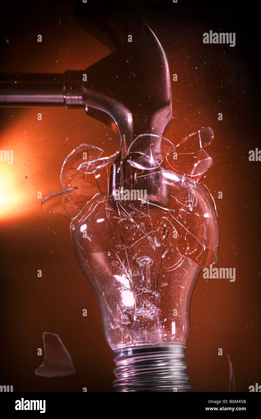 Conventional incandescent light bulb crushed by hammer Stock Photo Alamy