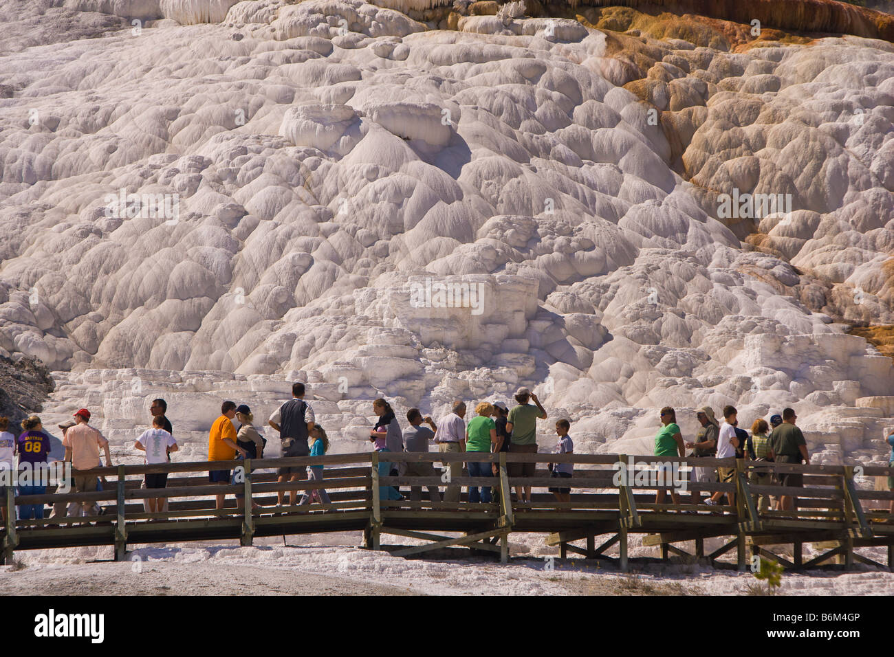 YELLOWSTONE NATIONAL PARK, WYOMING, USA - Tourists on boardwalk at Palette Spring area of the Mammoth Hot Springs Terraces Stock Photo