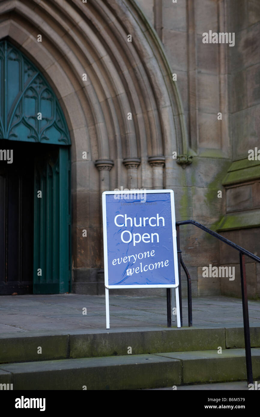 Church open everyone sign board outside church doorway Stock
