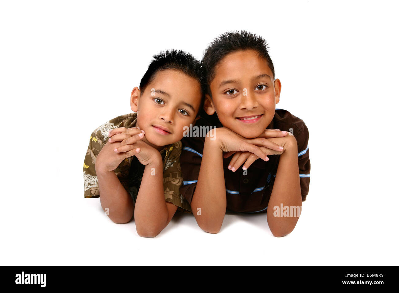 2 Happy Hispanic Boys on White Background Stock Photo