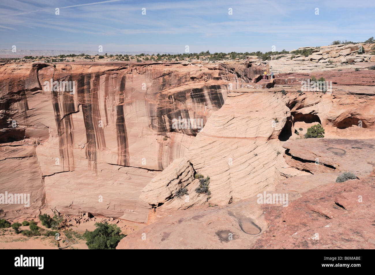 Overview of the Antelope House Ruin showing the viewpoint overlook with tourists at Canyon de Chelly National Monument Arizona Stock Photo