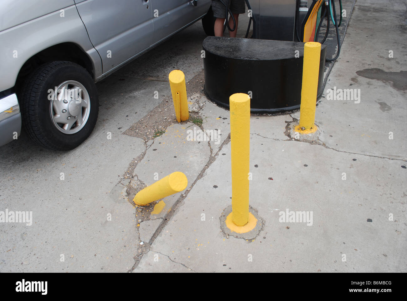 abused gas pump guard posts in Kansas USA Stock Photo