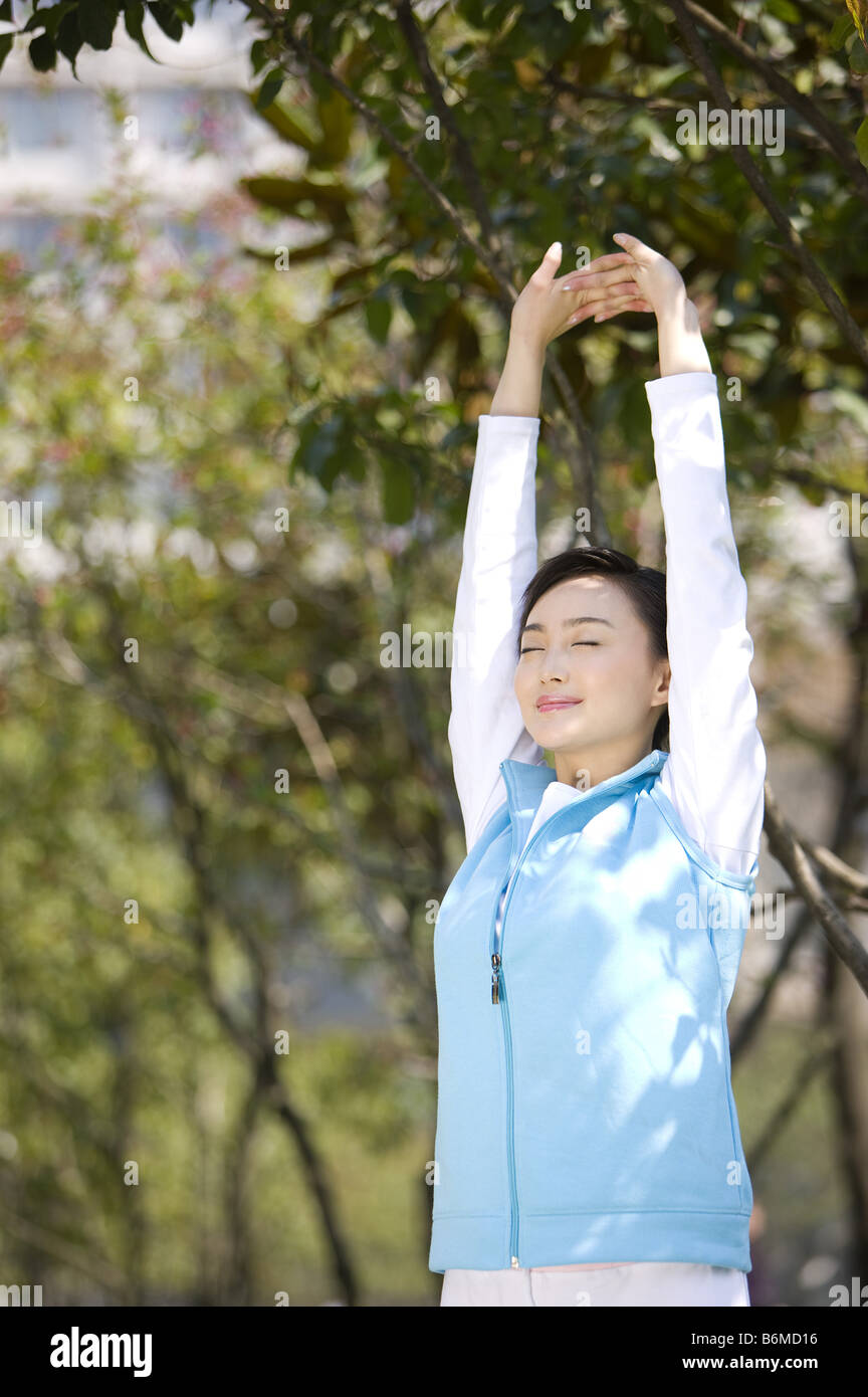 Chinese women stretching arms hi-res stock photography and images - Alamy