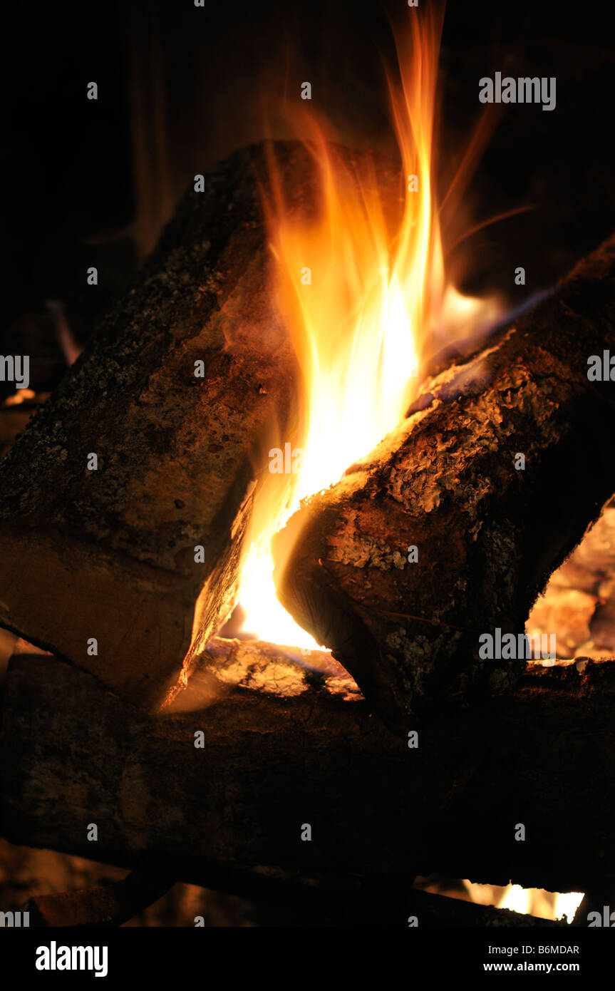 Logs blazing in fireplace Stock Photo