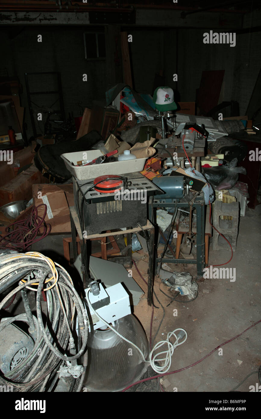 Trash And Junk In Dirt Floor Basement Covered In Dust And Stock