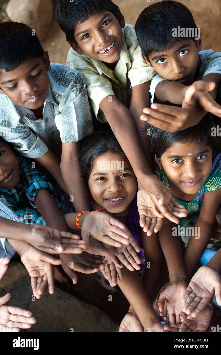 Indian children playing together huddled in a group. Andhra Pradesh, India Stock Photo