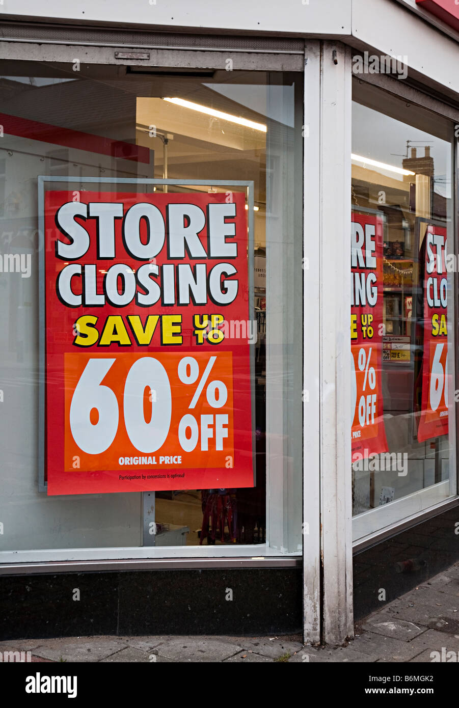 Store Closing sign in shop window of Woolworths Cardiff UK Stock Photo