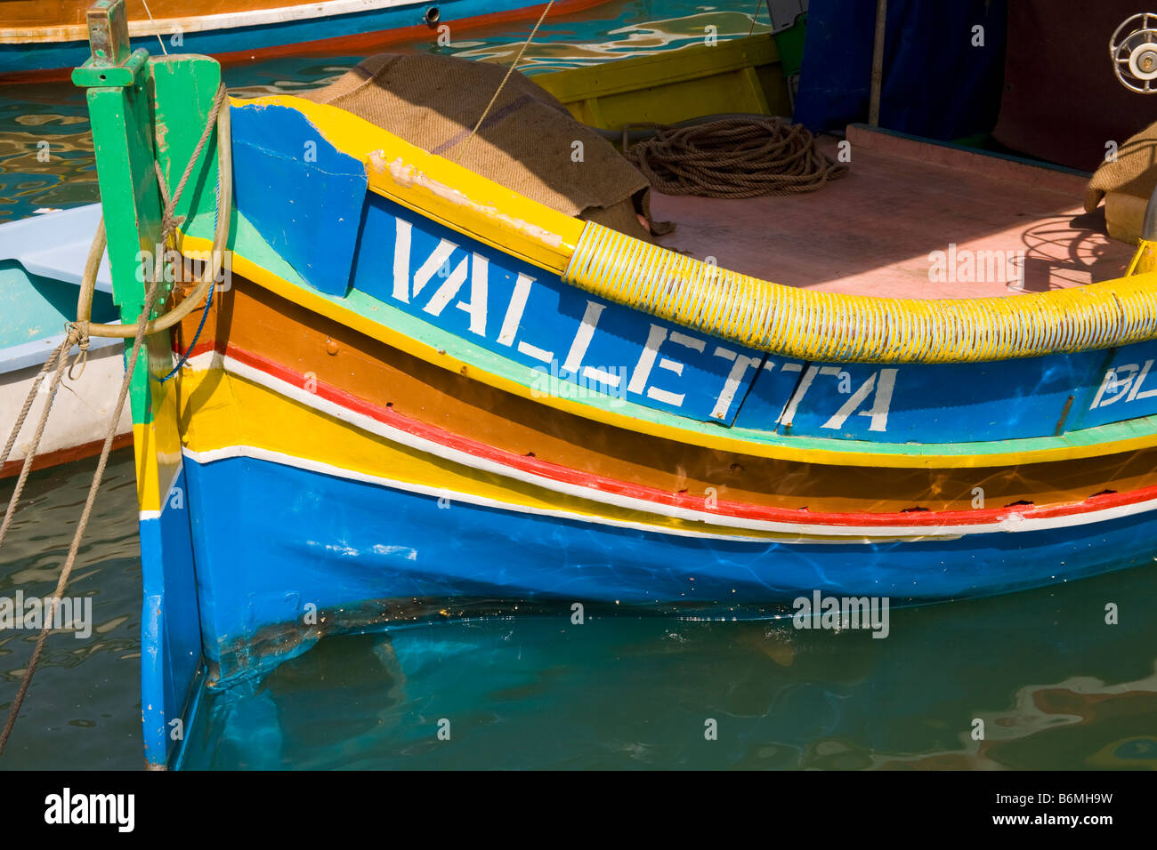 Luzzu fishing boat moored in Marsaxlokk Harbour, Marsaxlokk, Malta Stock Photo