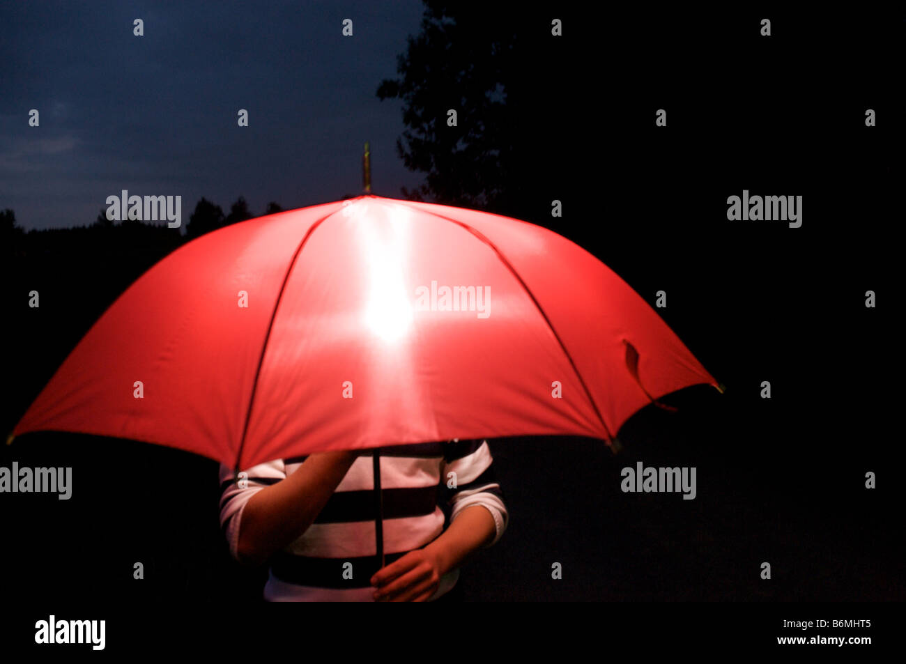 red umbrella with flash at night Stock Photo Alamy