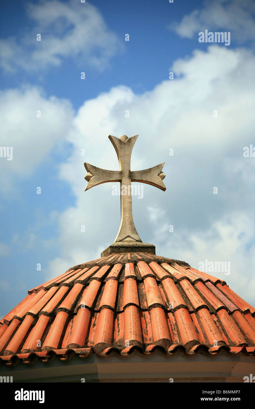 Cross at tiled dome day Stock Photo
