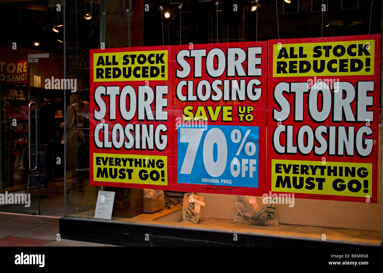 Shop window sale sign display store closing stock reduced, Scotland, UK, Europe Stock Photo