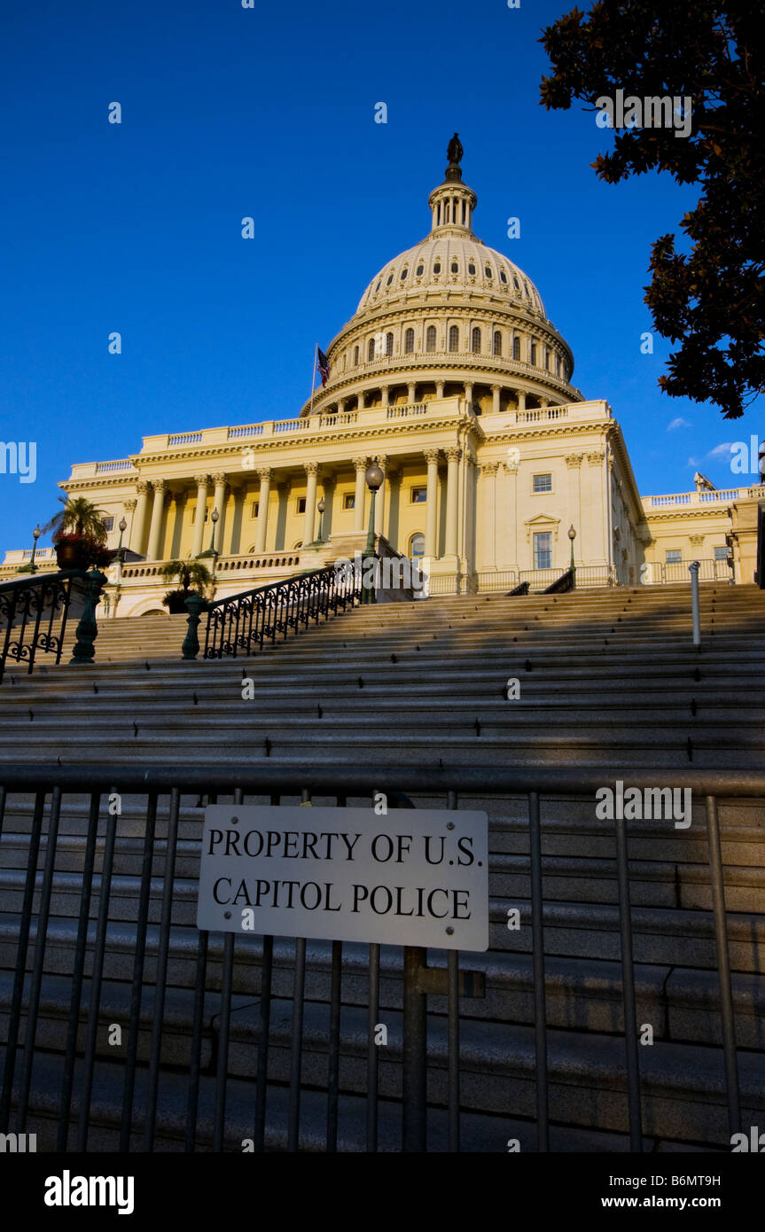 A view of the US Capitol Building in Washington D.C. with barricade fence and Capitol Police property sign in foreground Stock Photo