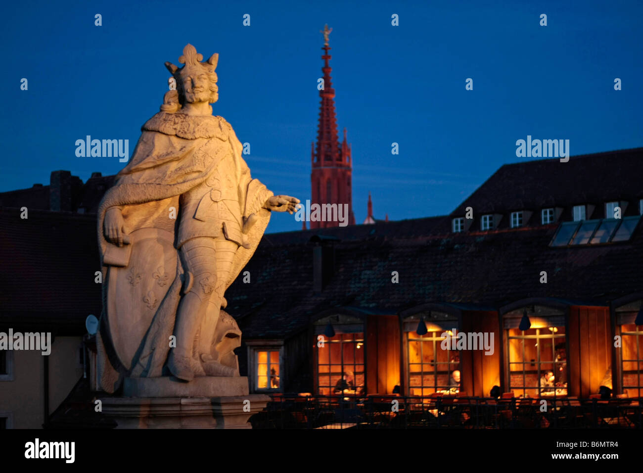 statue on the Old Main Bridge and the tower of The Church of Our Lady Marienkapelle in Wuerzburg Bavaria Germany Stock Photo