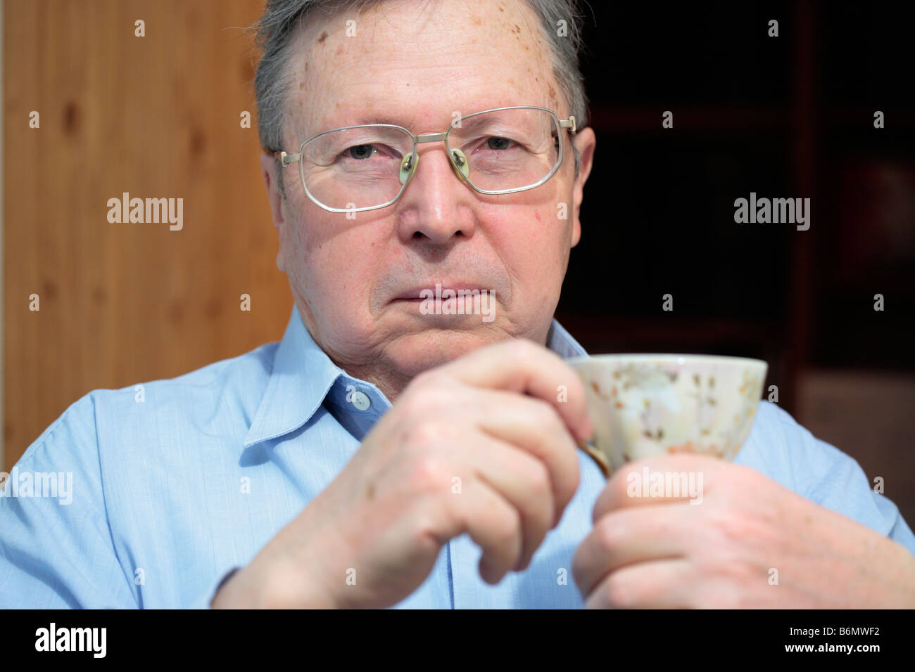 Senior man drinking tea Stock Photo - Alamy