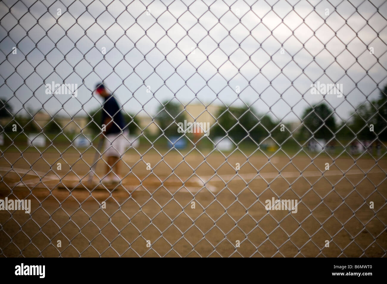 A baseball player gets ready to hit a ball Stock Photo