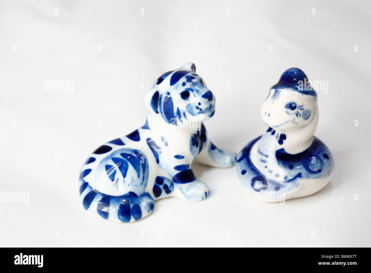 Tiger and snake, hand made traditional blue white ceramics, Gzhel, Moscow region, Russia Stock Photo