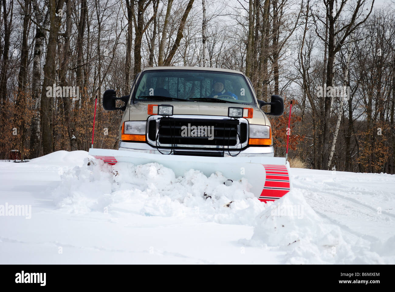 Plowing snow with a pickup truck Stock Photo