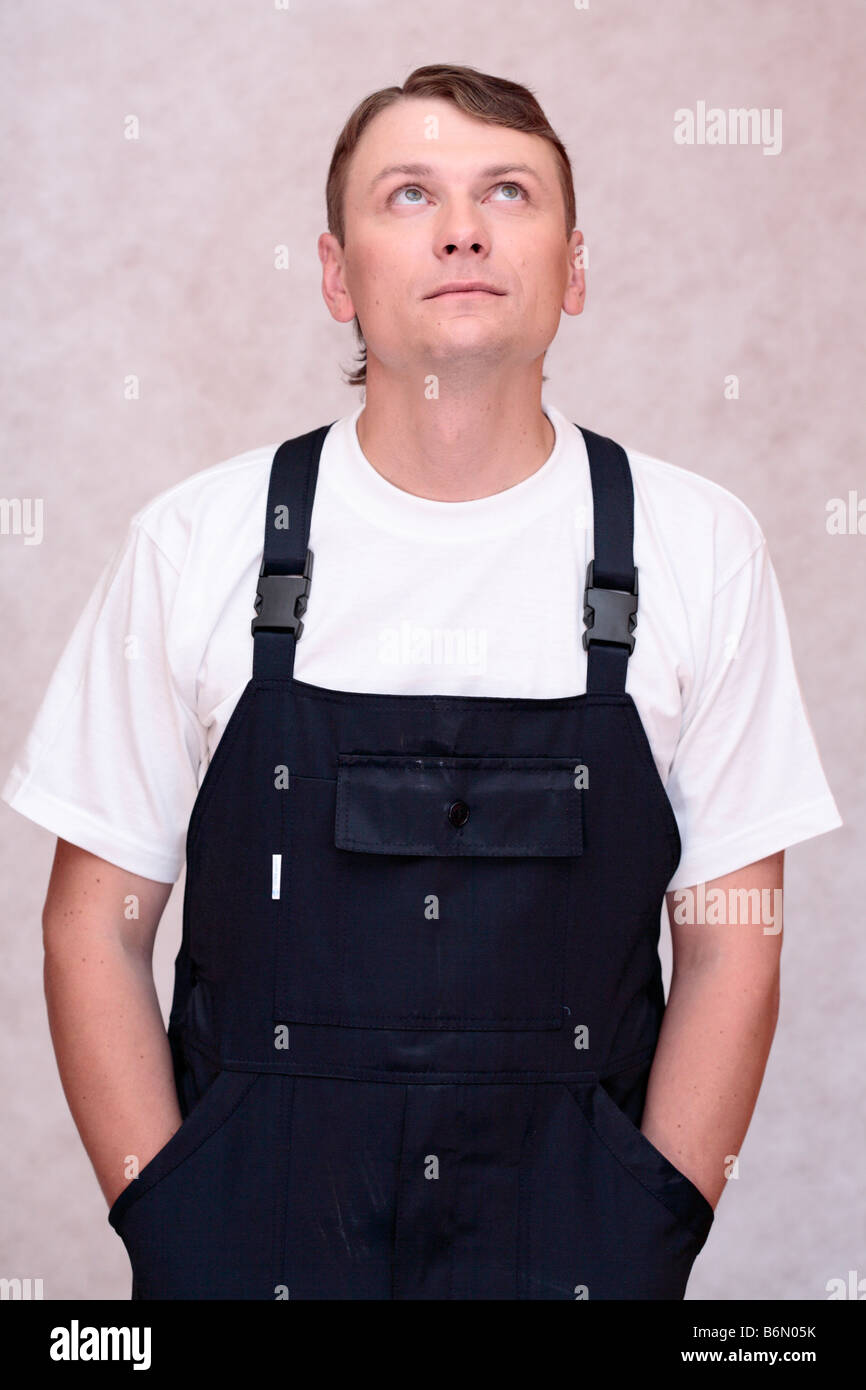 Worker man Personnel Uniform stuff employment one person industry industrial male occupation thinking Stock Photo