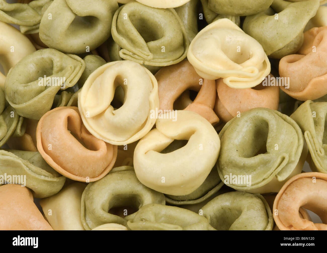 close up of tortellini tricolore pasta for backgrounds Stock Photo