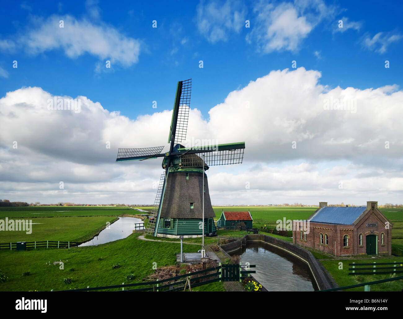 beautiful windmill landscape near the IJsselmeer in the netherlands Stock Photo