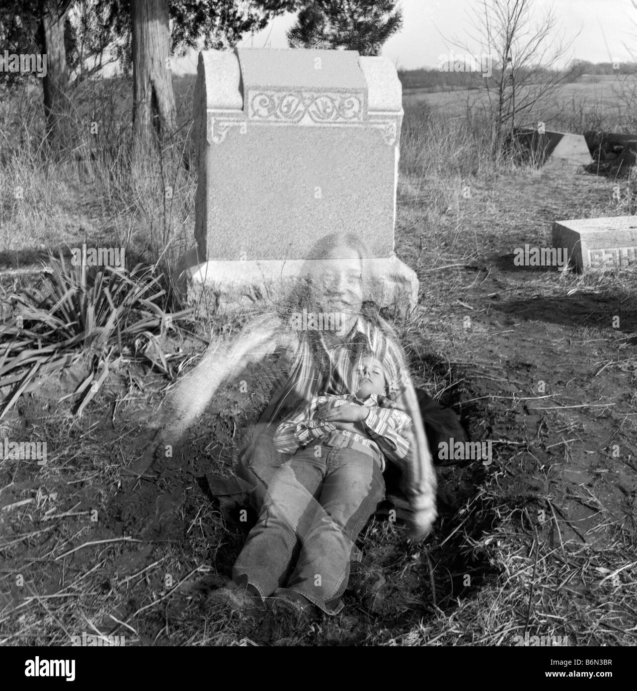 Girl rising from dead, coming out of grave Stock Photo Alamy