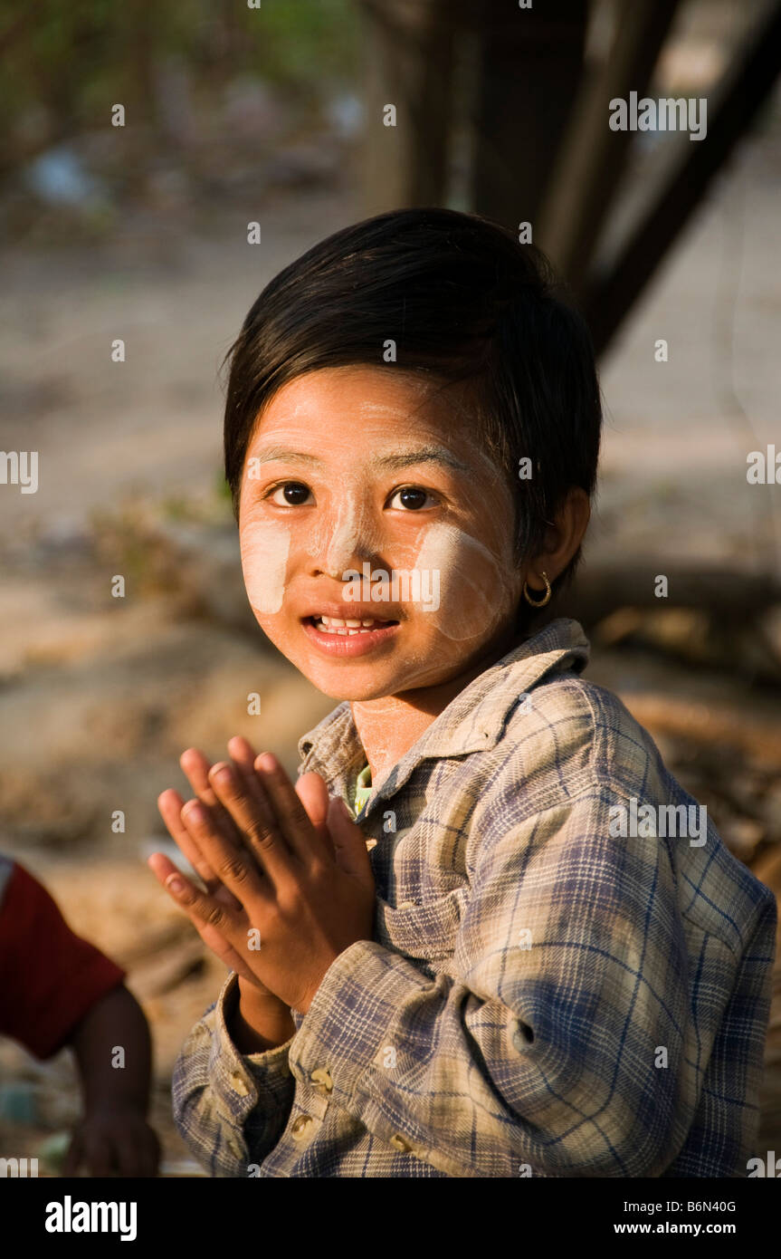 Burmese Karen girl giving a wai greeting in northern Thailand Stock Photo